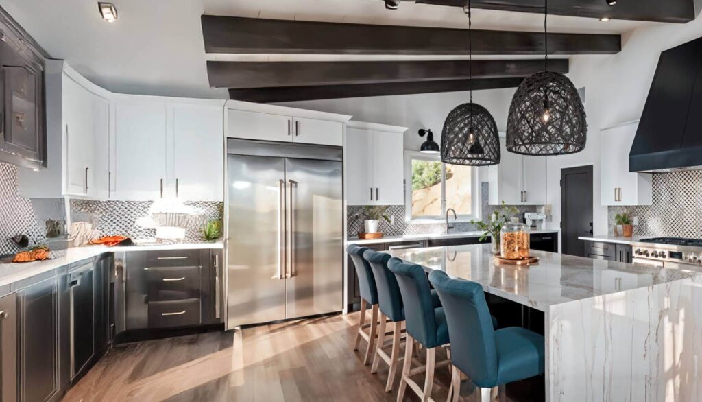 Kitchen with net-like light shades,, an eating island and blue chairs